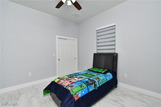 bedroom featuring ceiling fan and a closet