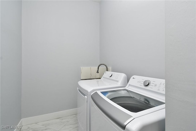 laundry area with washing machine and dryer