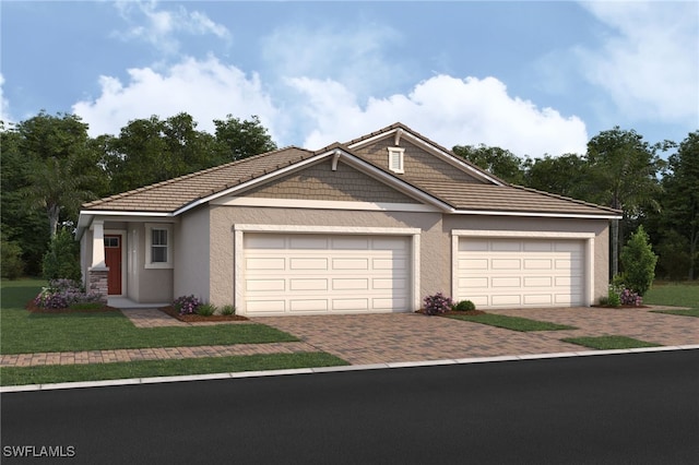 view of front of house with a garage and a front yard