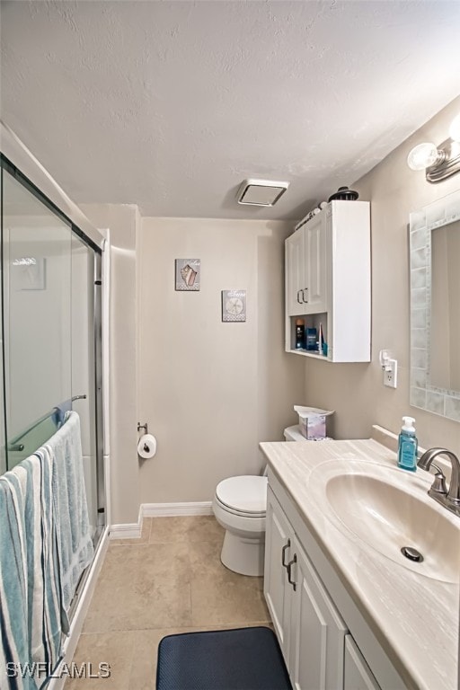 bathroom with walk in shower, tile patterned flooring, a textured ceiling, toilet, and vanity