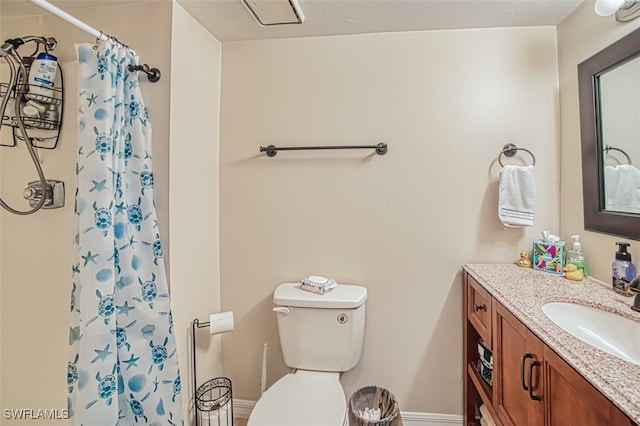 bathroom with toilet, vanity, and a shower with shower curtain