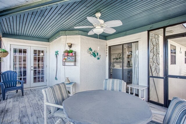 sunroom with ceiling fan and french doors