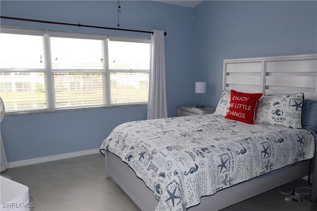 bedroom featuring multiple windows