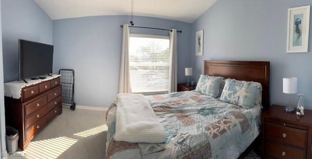 bedroom with light carpet and vaulted ceiling