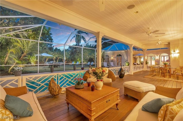 exterior space with a lanai, an outdoor living space, and ceiling fan