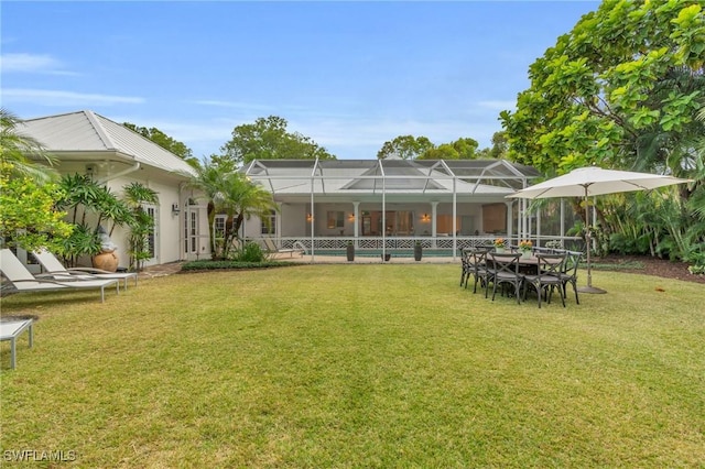 view of yard featuring glass enclosure