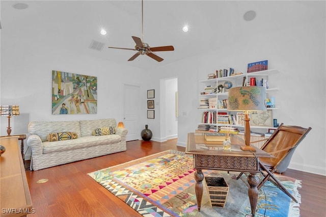 sitting room with ceiling fan and hardwood / wood-style flooring