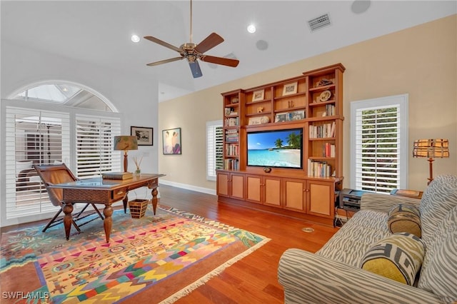 living room featuring light wood-type flooring and ceiling fan