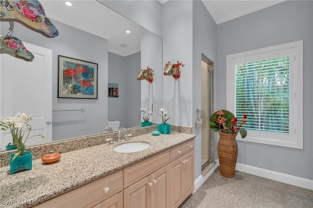 bathroom with walk in shower and vanity