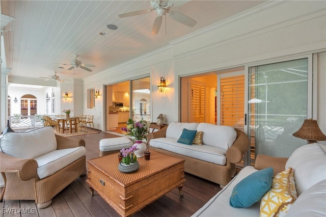 sunroom / solarium featuring ceiling fan and wooden ceiling