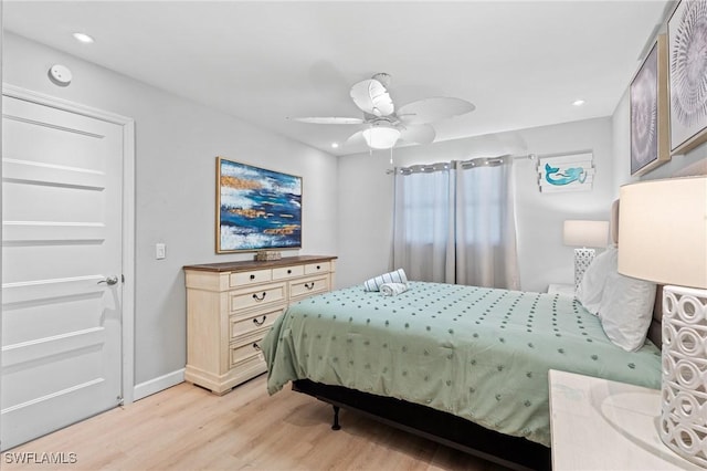 bedroom featuring ceiling fan and light hardwood / wood-style flooring