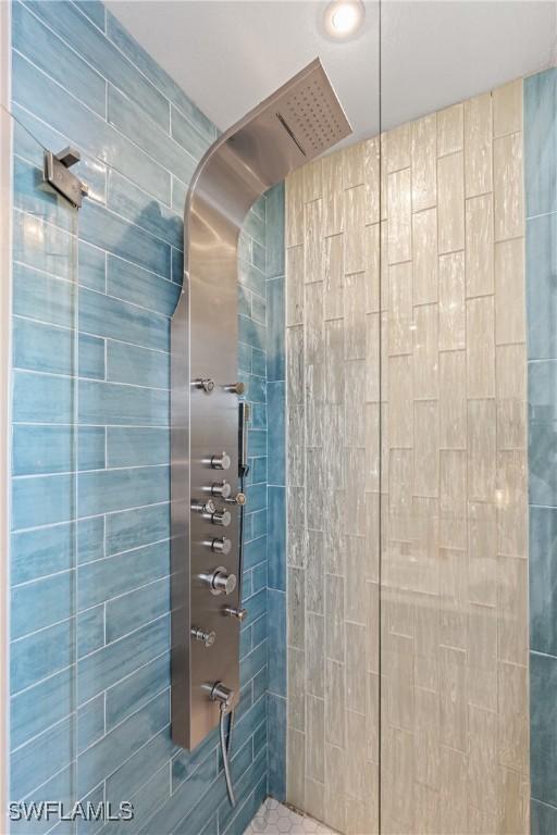 bathroom with a tile shower