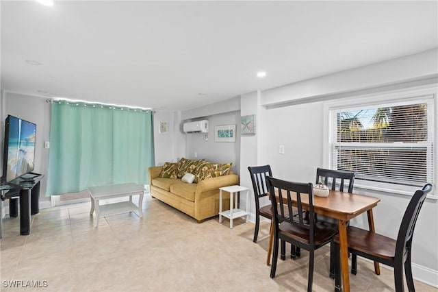 dining area featuring a wall mounted air conditioner and light tile patterned floors