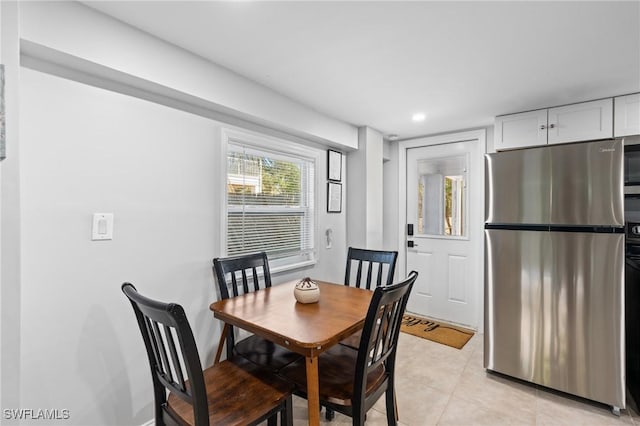 dining space with light tile patterned floors