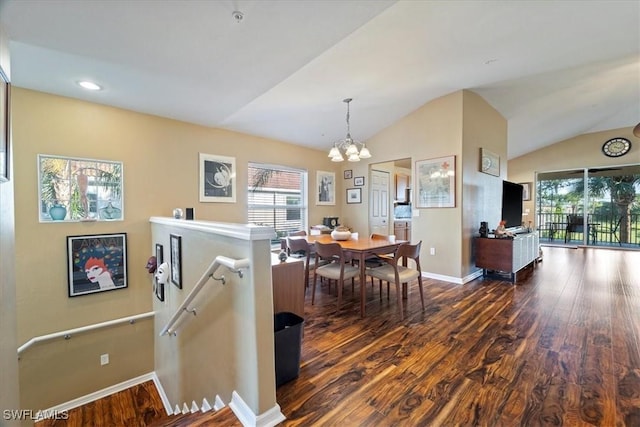 dining space featuring lofted ceiling, a chandelier, and dark wood-type flooring