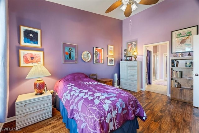 bedroom with hardwood / wood-style flooring and ceiling fan