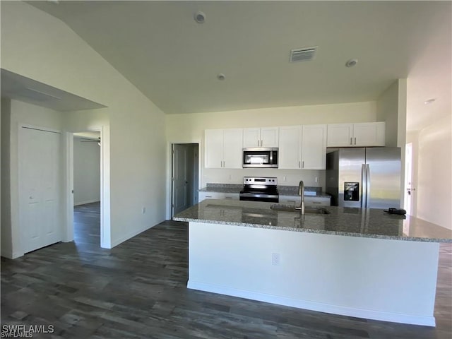 kitchen featuring sink, appliances with stainless steel finishes, a center island with sink, white cabinets, and stone countertops