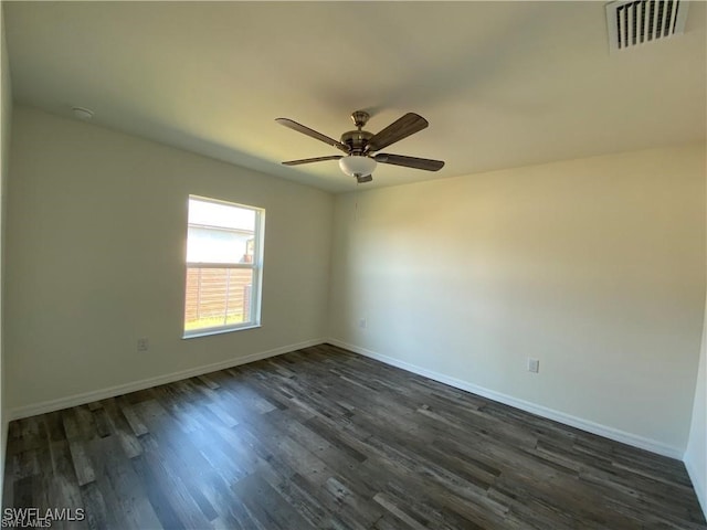 empty room featuring dark hardwood / wood-style floors and ceiling fan