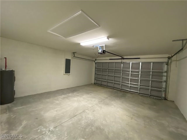 garage with a garage door opener, electric panel, and electric water heater