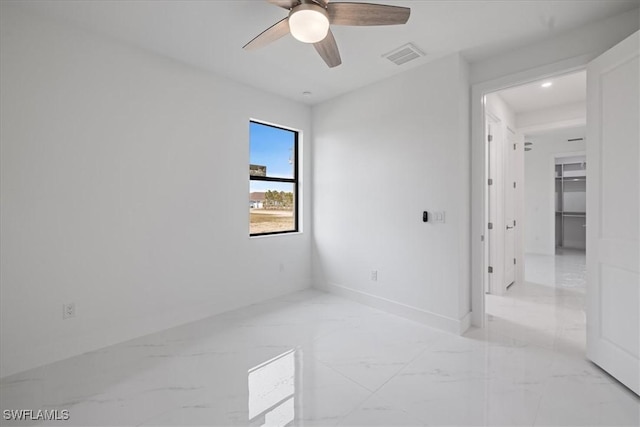 empty room featuring ceiling fan