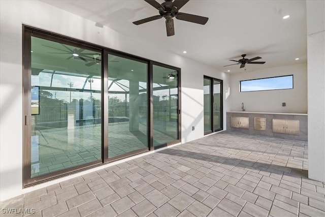 view of patio with ceiling fan