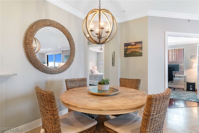 dining area with crown molding and a chandelier