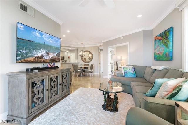 living room with ceiling fan and ornamental molding