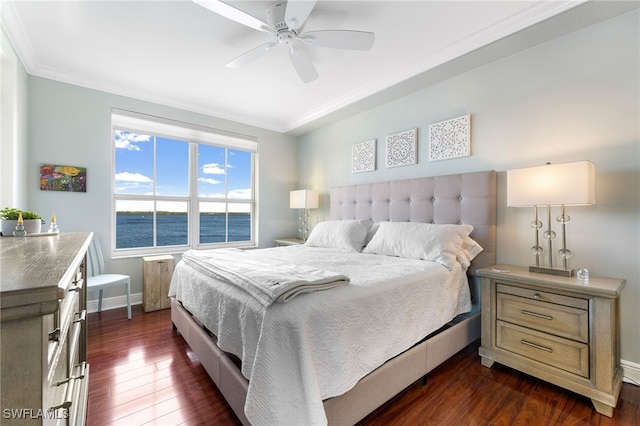 bedroom with ceiling fan, a water view, dark wood-type flooring, and ornamental molding