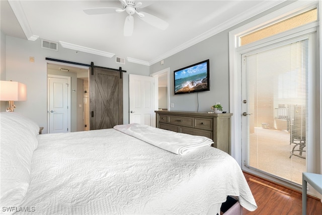 bedroom with crown molding, ceiling fan, a barn door, dark hardwood / wood-style floors, and multiple windows