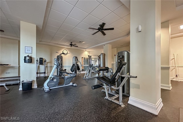 gym with a drop ceiling and ceiling fan