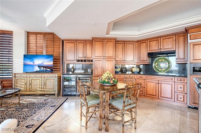 kitchen featuring a raised ceiling, backsplash, dark stone countertops, and wine cooler