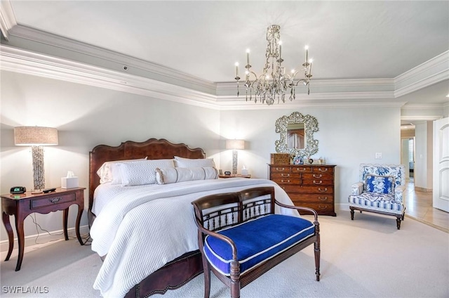 bedroom with carpet, an inviting chandelier, ornamental molding, and a tray ceiling