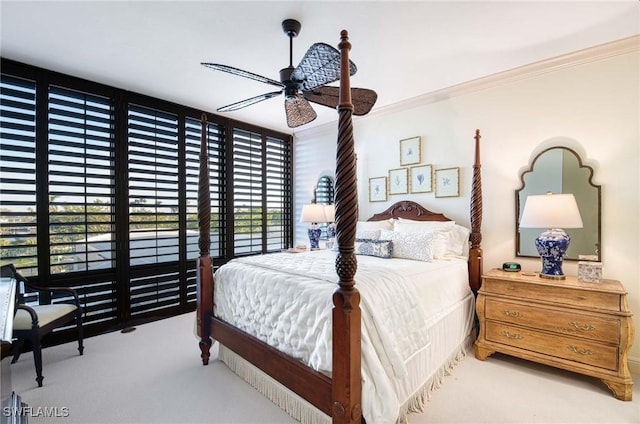 bedroom with ceiling fan, crown molding, and light carpet