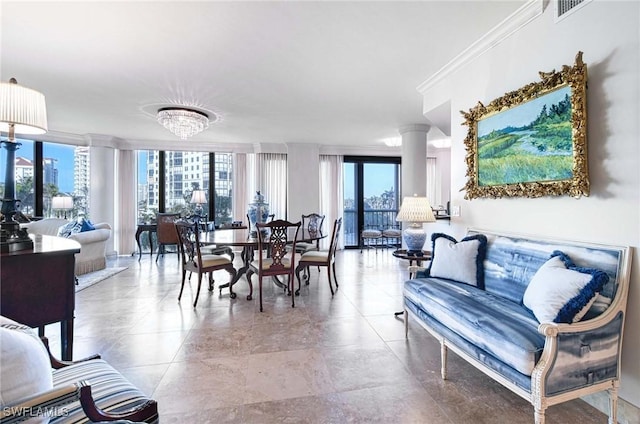 dining space featuring a wall of windows, crown molding, and ornate columns