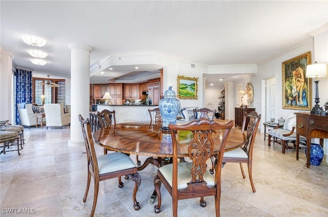 dining space with ornamental molding and ornate columns