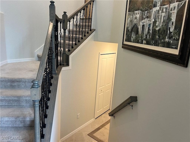 staircase with tile patterned flooring