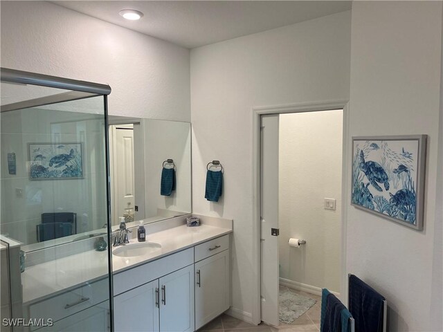 bathroom with vanity and tile patterned flooring