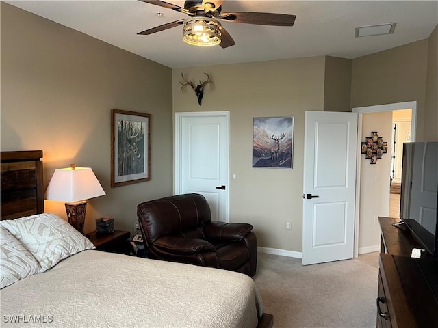 bedroom featuring light colored carpet and ceiling fan