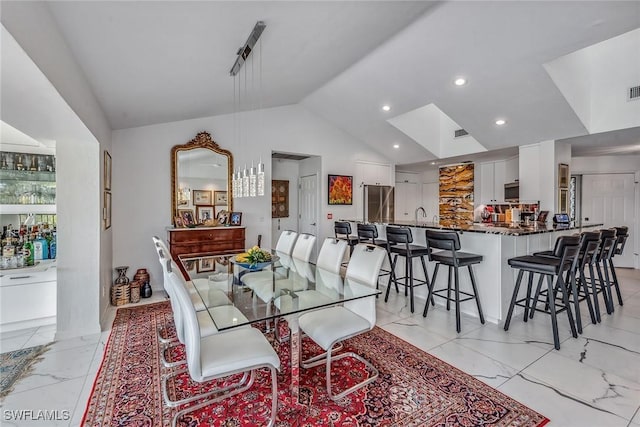 dining area with vaulted ceiling