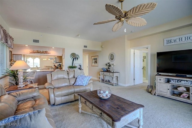 living room featuring ceiling fan and light colored carpet