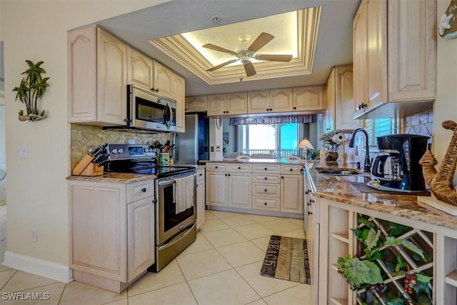 kitchen featuring sink, stainless steel appliances, ceiling fan, and light tile patterned floors