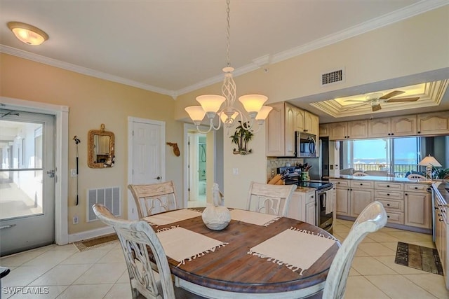 dining space featuring light tile patterned flooring, a raised ceiling, crown molding, and ceiling fan with notable chandelier