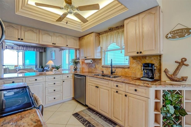 kitchen featuring stainless steel appliances, ornamental molding, decorative backsplash, a tray ceiling, and sink