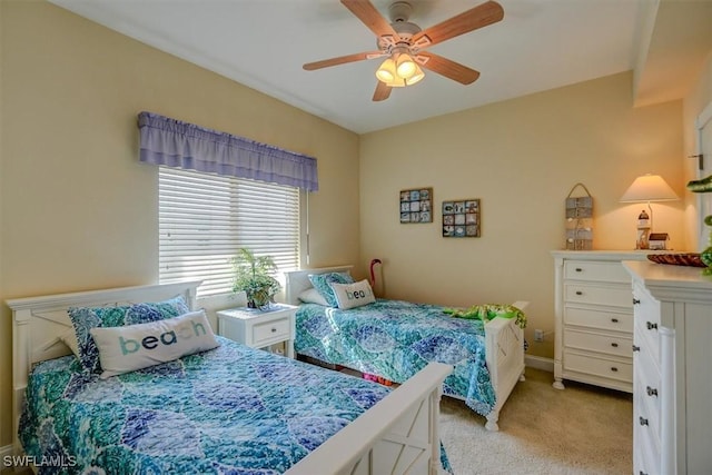 bedroom with light carpet and ceiling fan