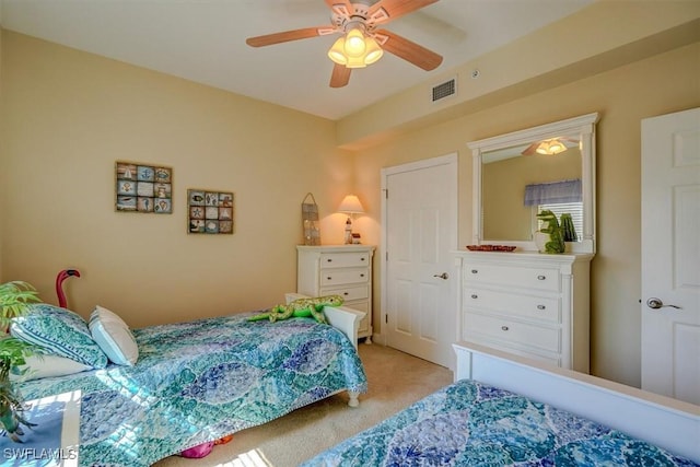 carpeted bedroom with ceiling fan