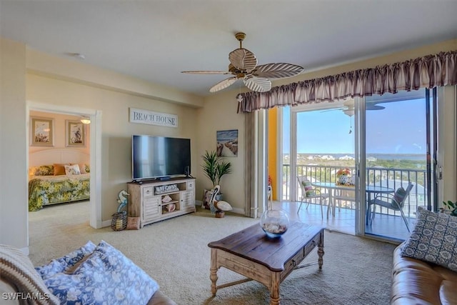 living room with carpet floors and ceiling fan