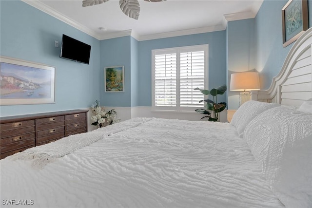 bedroom with ceiling fan and crown molding