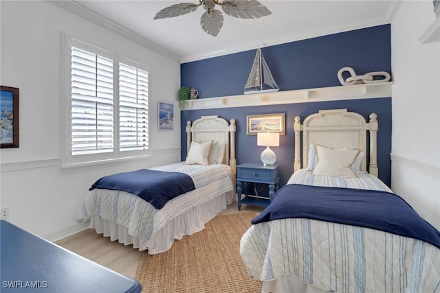 bedroom featuring wood-type flooring, ceiling fan, and crown molding