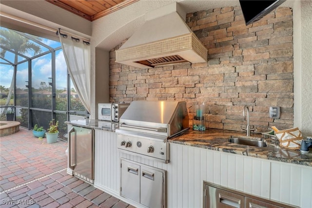 view of patio / terrace with sink and area for grilling