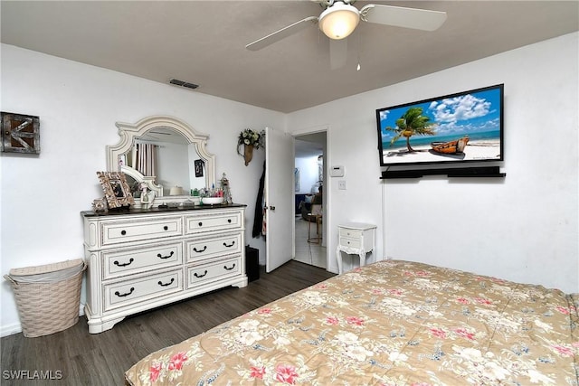 bedroom featuring ceiling fan and dark hardwood / wood-style floors